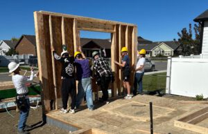 Langlas & Associates working with students from the Billings Career Center on the Student Built house.